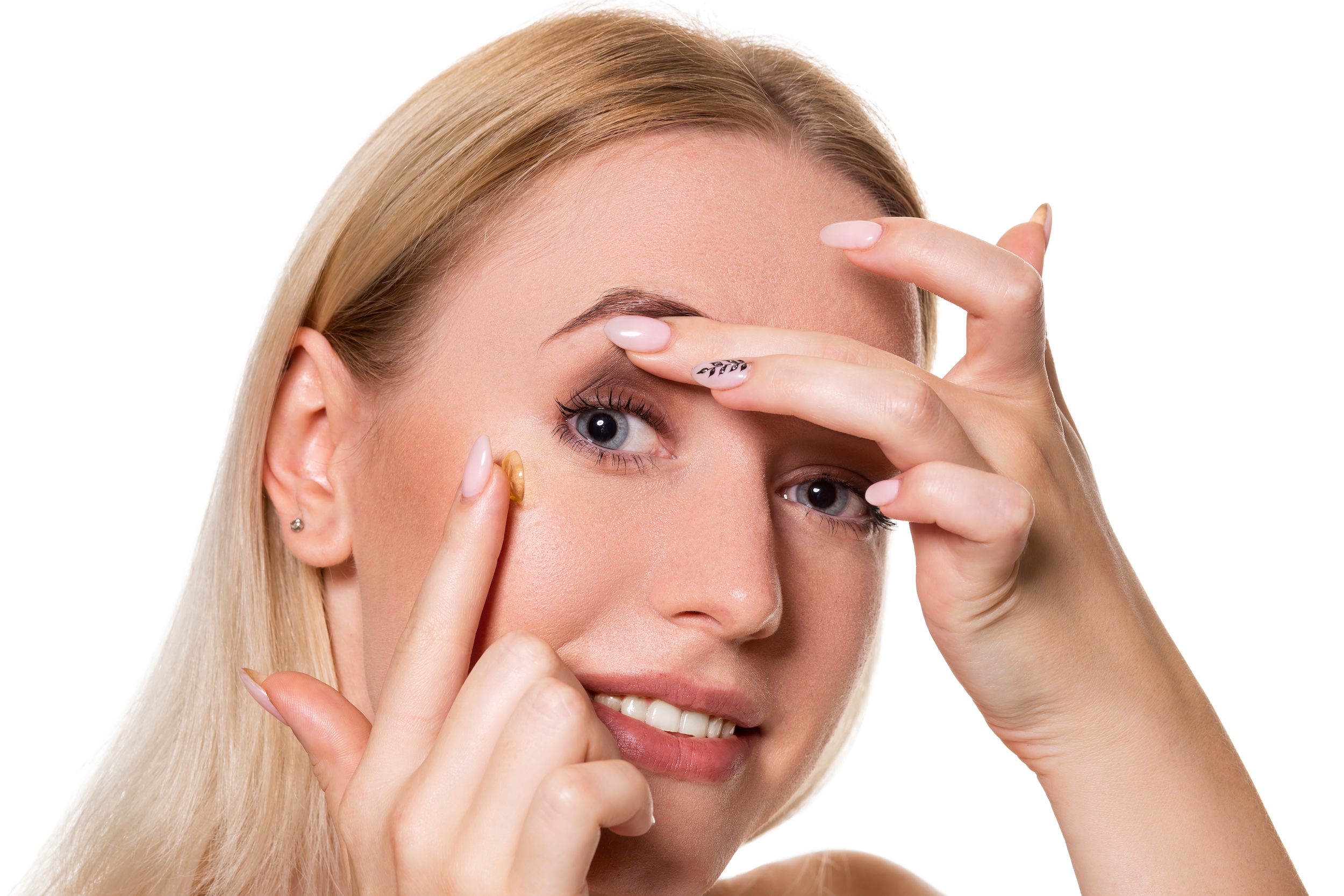 young woman holding contact lens index finger with copy space close up face healthy beautiful woman about wear contact lens eyesight ophthalmology concept